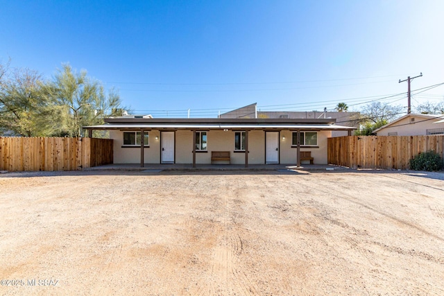 ranch-style house featuring solar panels