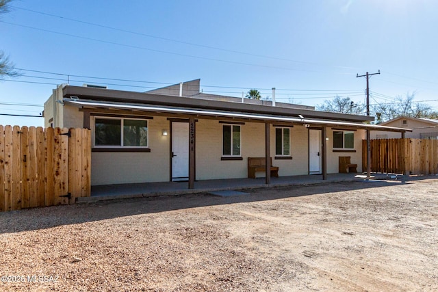 single story home featuring covered porch