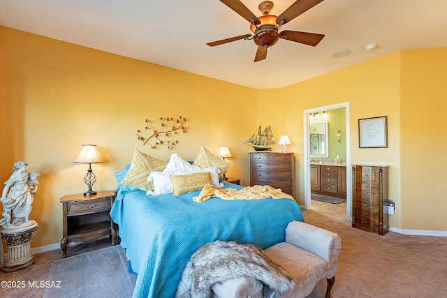 bedroom with connected bathroom, a ceiling fan, baseboards, and carpet floors