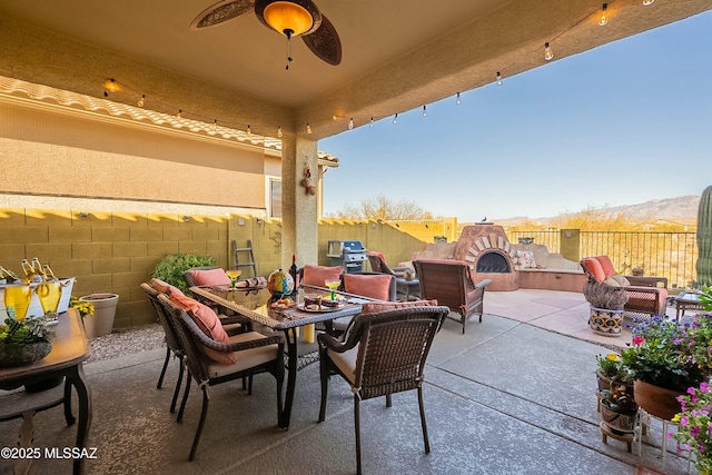 view of patio / terrace with grilling area, outdoor dining space, and a fenced backyard