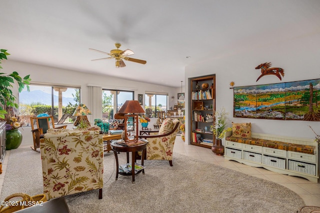 living room featuring light tile patterned floors and ceiling fan