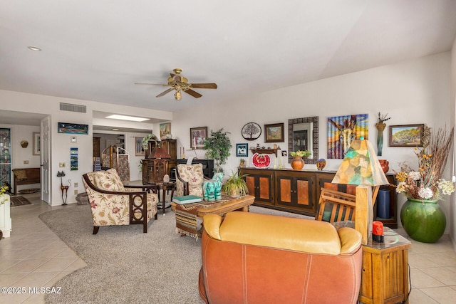 living room with light tile patterned flooring and ceiling fan