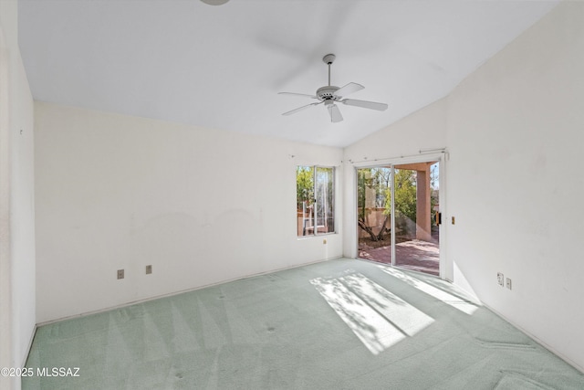 unfurnished room featuring ceiling fan, light carpet, and lofted ceiling