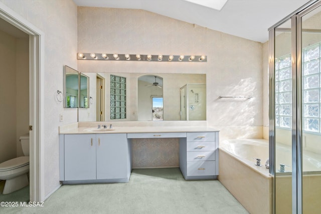 full bathroom with a wealth of natural light, toilet, vanity, and independent shower and bath