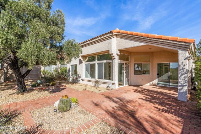 rear view of property with a patio area