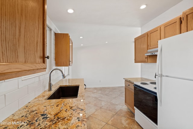 kitchen with sink, light stone counters, white appliances, light tile patterned floors, and tasteful backsplash