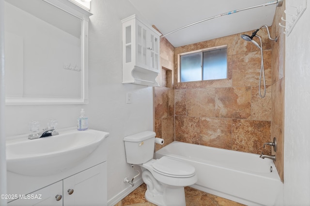 full bathroom featuring toilet, tiled shower / bath, tile patterned floors, and vanity