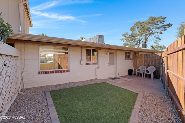 back of property with a patio area and cooling unit