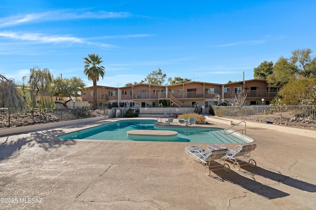 view of swimming pool with a patio area