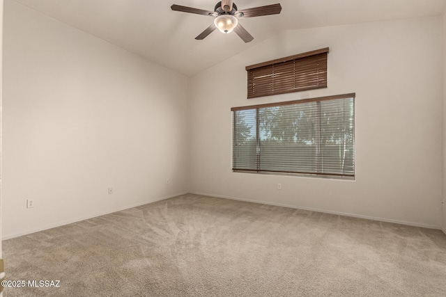 unfurnished room with lofted ceiling, ceiling fan, and carpet