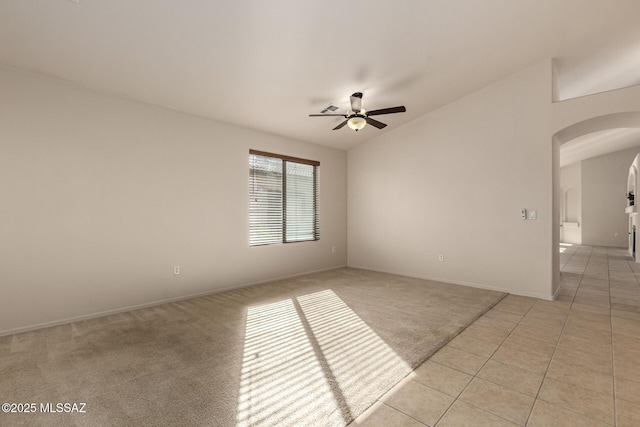 carpeted empty room featuring ceiling fan