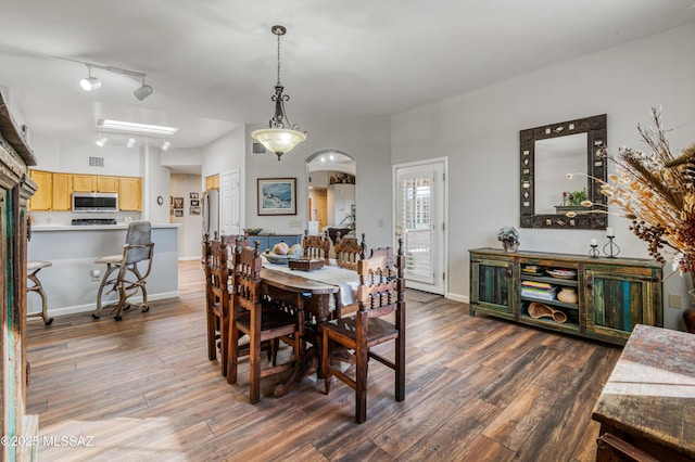 dining room with dark hardwood / wood-style flooring