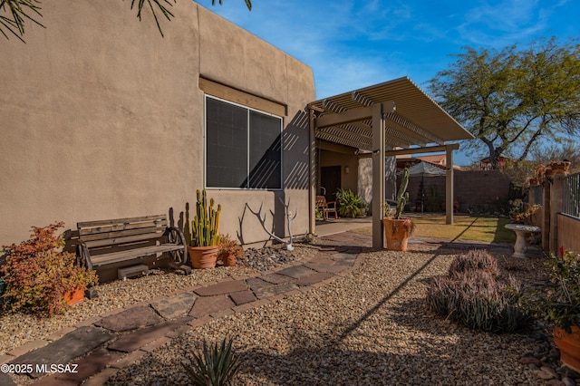 exterior space with a pergola and a patio