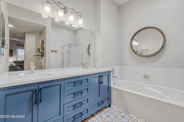 bathroom featuring a tub, tile patterned floors, and vanity