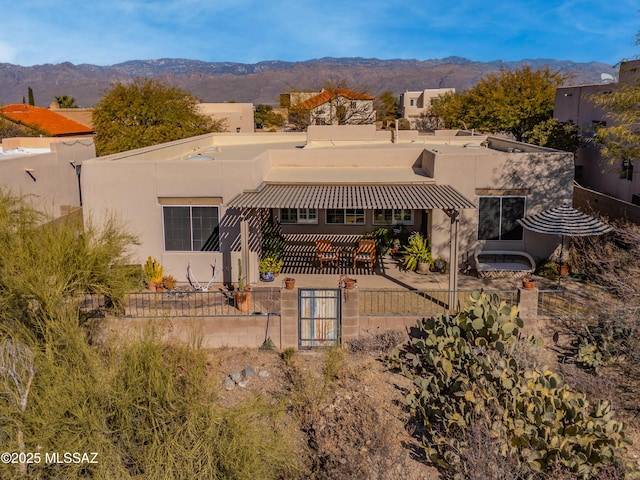 rear view of property featuring a mountain view