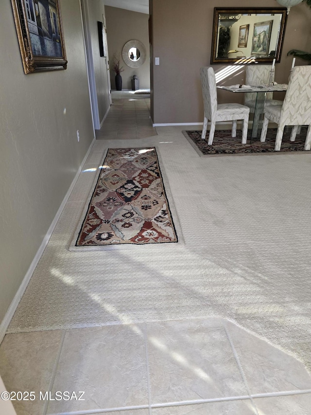 hallway with tile patterned flooring