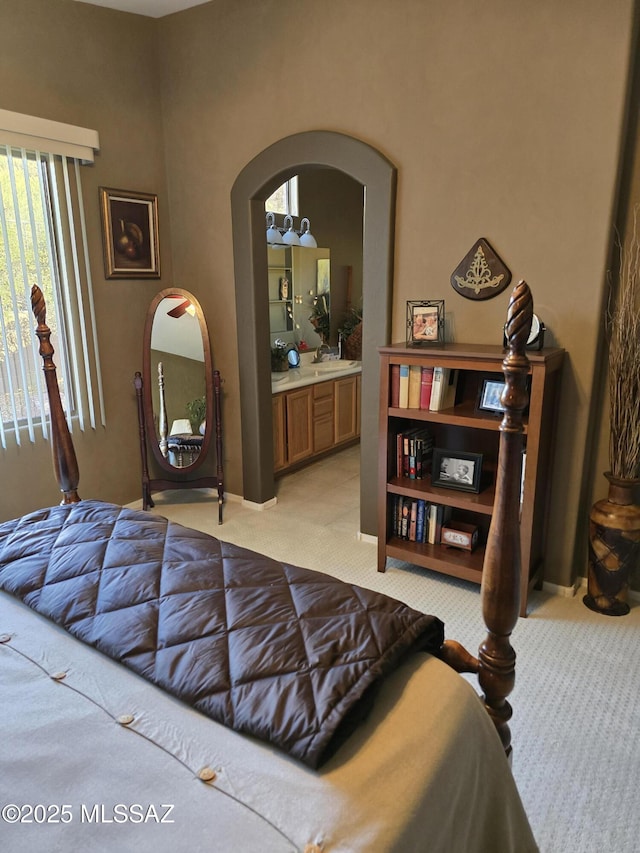 carpeted bedroom with ensuite bathroom