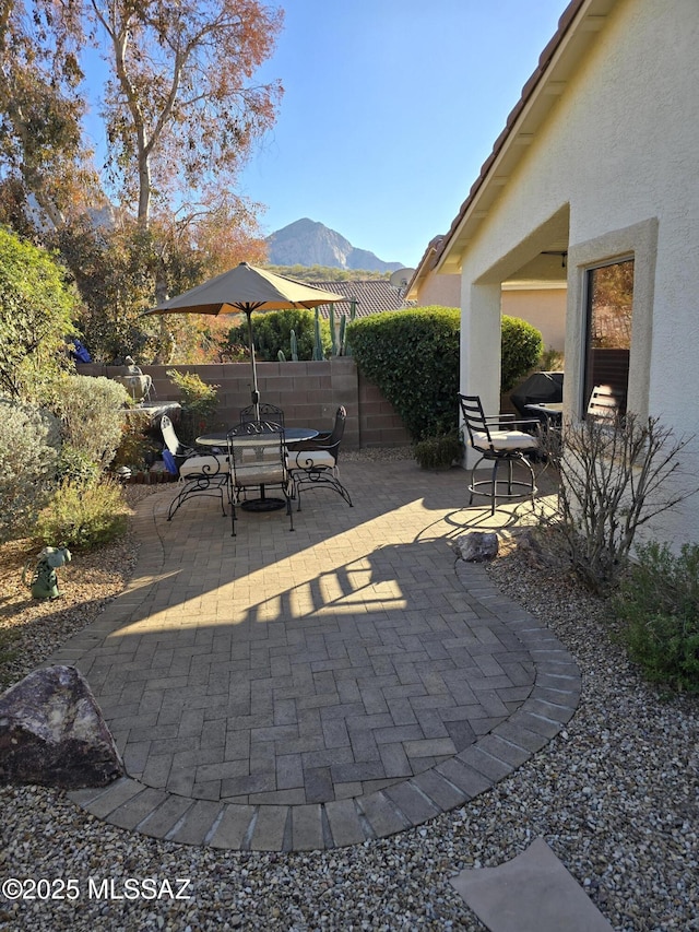 view of patio / terrace featuring a mountain view