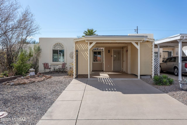 view of front of home featuring a carport