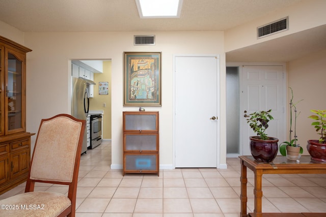 interior space featuring light tile patterned flooring