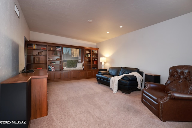 living room featuring recessed lighting and light colored carpet