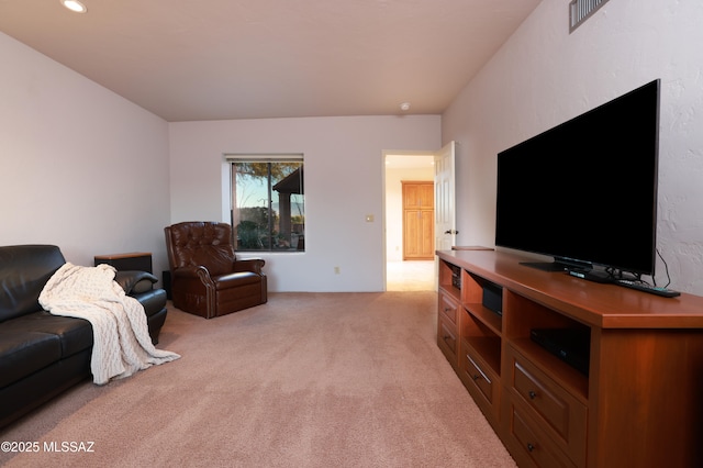 living room featuring light carpet, visible vents, and recessed lighting