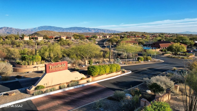 birds eye view of property with a mountain view