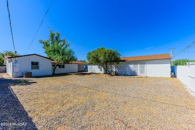 back of property with cooling unit