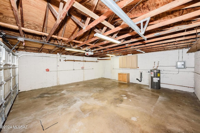 garage featuring water heater and a garage door opener