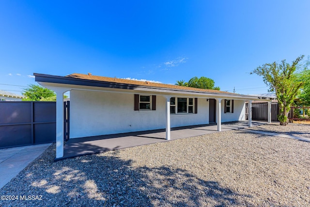 rear view of property featuring a patio