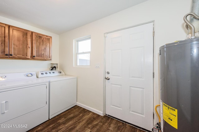 laundry room featuring separate washer and dryer, dark hardwood / wood-style flooring, cabinets, and gas water heater