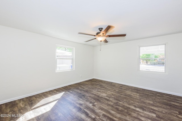 spare room featuring dark wood-type flooring