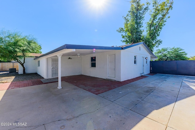 view of front of house featuring a patio and central AC