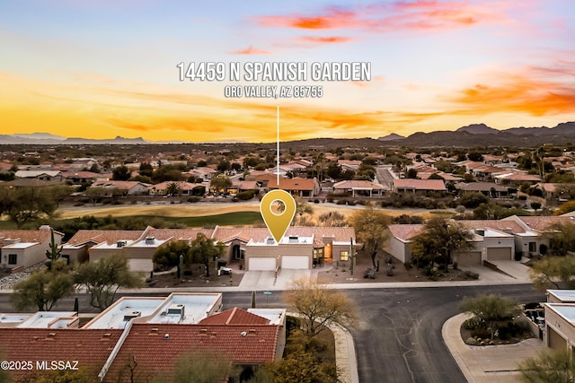 aerial view at dusk with a mountain view