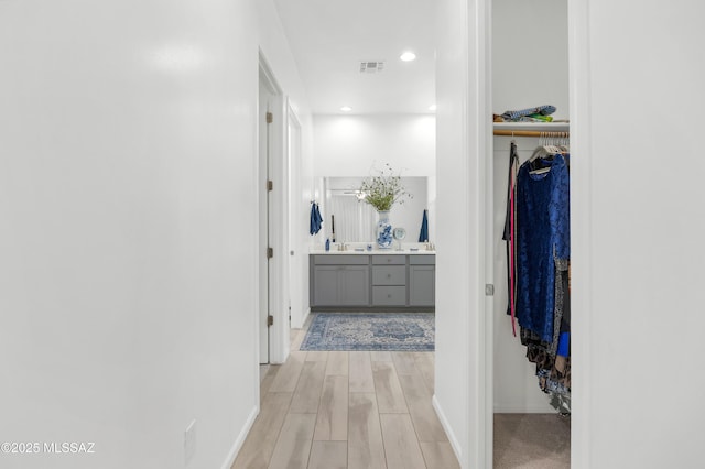 corridor featuring light hardwood / wood-style flooring