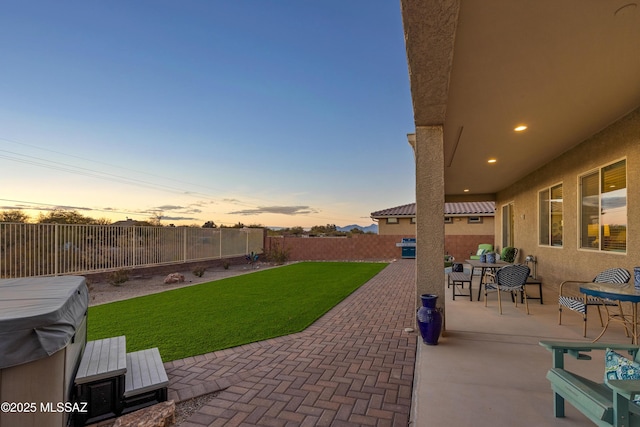 patio terrace at dusk with a yard