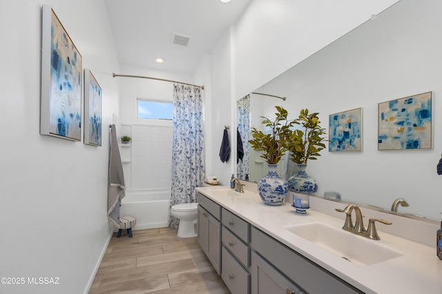 full bathroom with vanity, toilet, and shower / bath combo