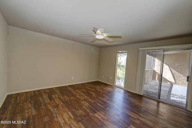 empty room featuring dark wood-type flooring and ceiling fan