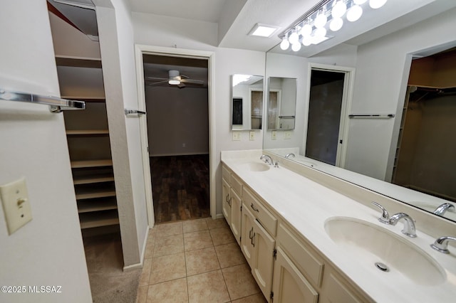 bathroom featuring vanity, tile patterned floors, and ceiling fan