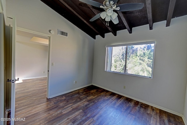 empty room featuring ceiling fan, vaulted ceiling with beams, and dark wood-type flooring