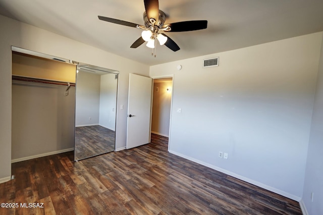 unfurnished bedroom featuring a closet, ceiling fan, and dark hardwood / wood-style floors