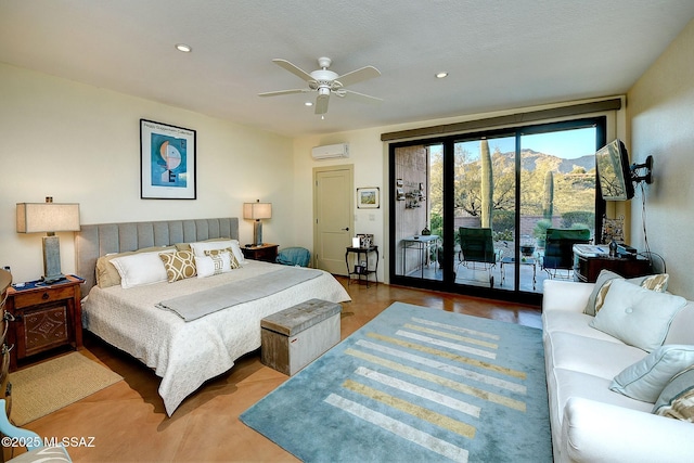 bedroom with ceiling fan, access to exterior, and a wall unit AC