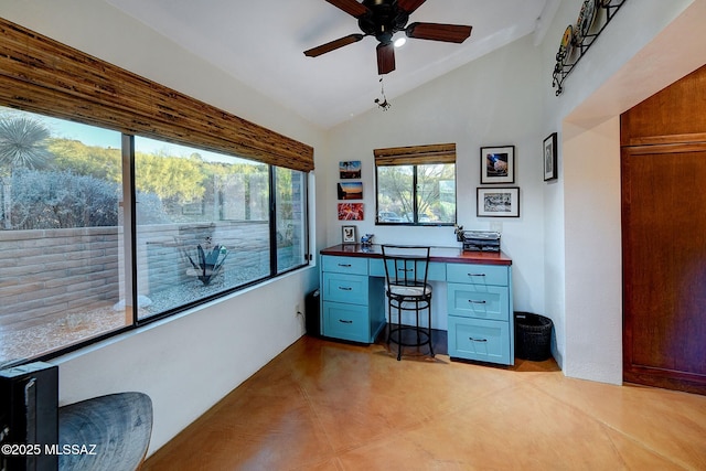 office space featuring ceiling fan, lofted ceiling, and built in desk