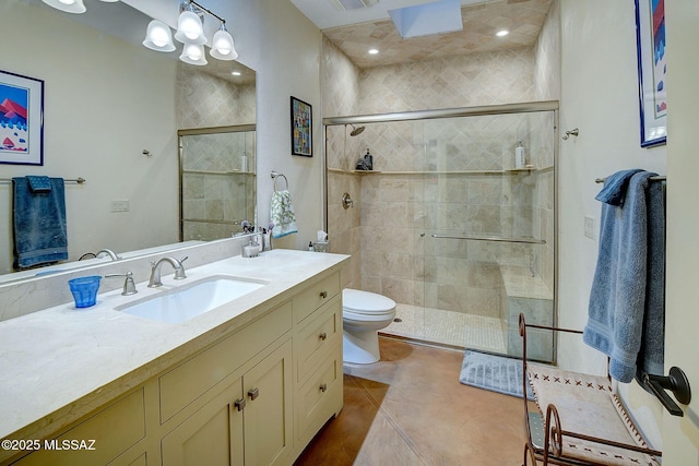 bathroom featuring vanity, walk in shower, toilet, tile patterned floors, and an inviting chandelier