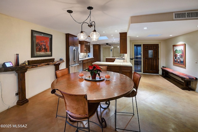 dining area with ceiling fan