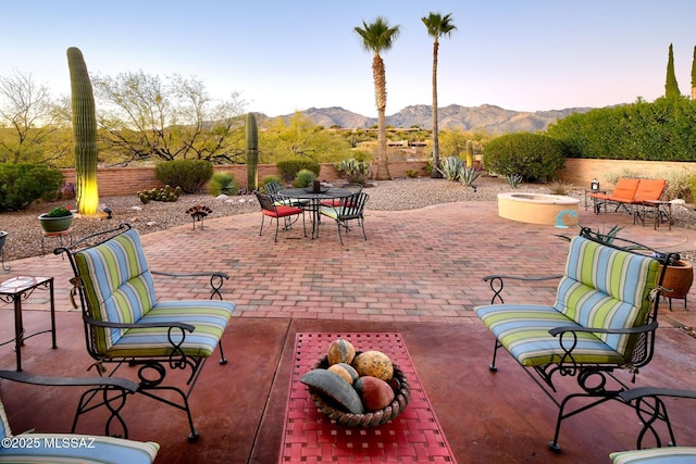 view of patio / terrace featuring a mountain view