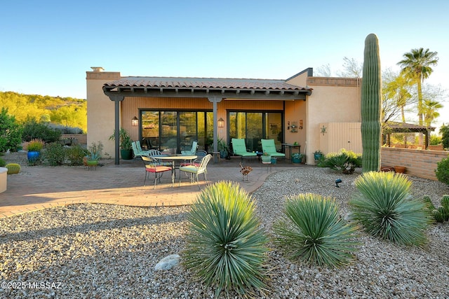 back of property featuring a patio