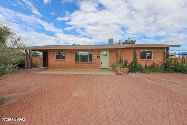 ranch-style house featuring a patio and central AC