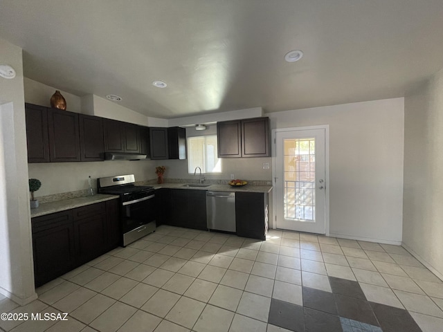 kitchen with sink, light tile patterned floors, and stainless steel appliances