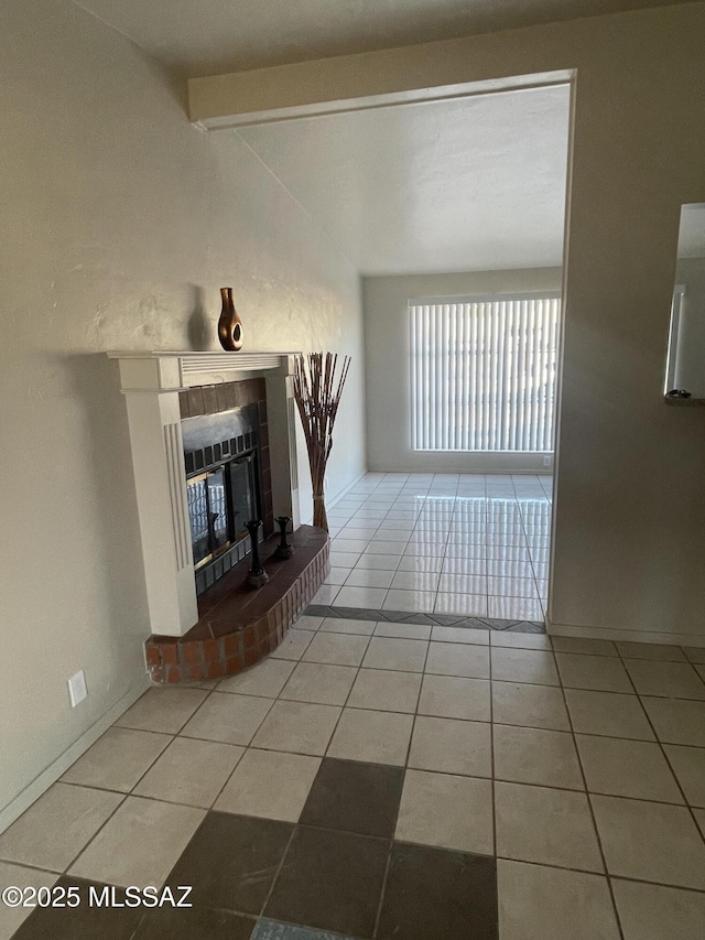 unfurnished living room with vaulted ceiling with beams, tile patterned floors, and a fireplace